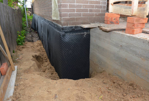 Happy homeowners after waterproofing job in Gladstone